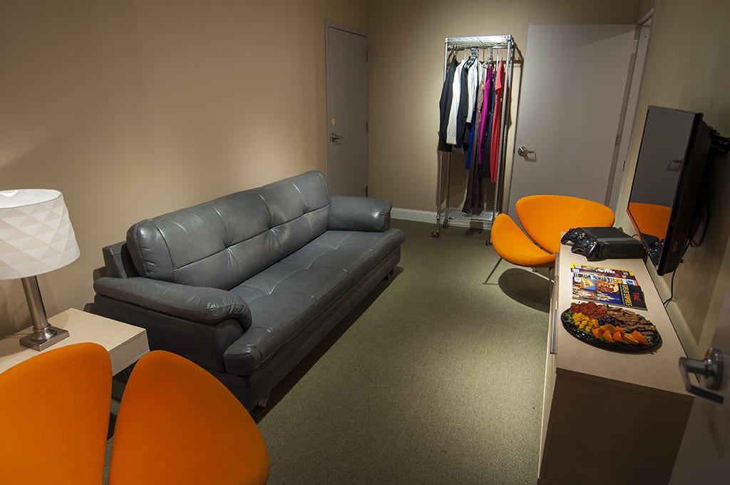 ThunderShot Studios talent green room with sofa, seating, wardrobe rack, and entertainment for actors and clients in Washington DC